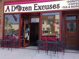 Front of a red building that reads "A Dozen Excuses".