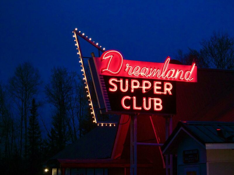 Neon sign for the dreamland supper club at night.