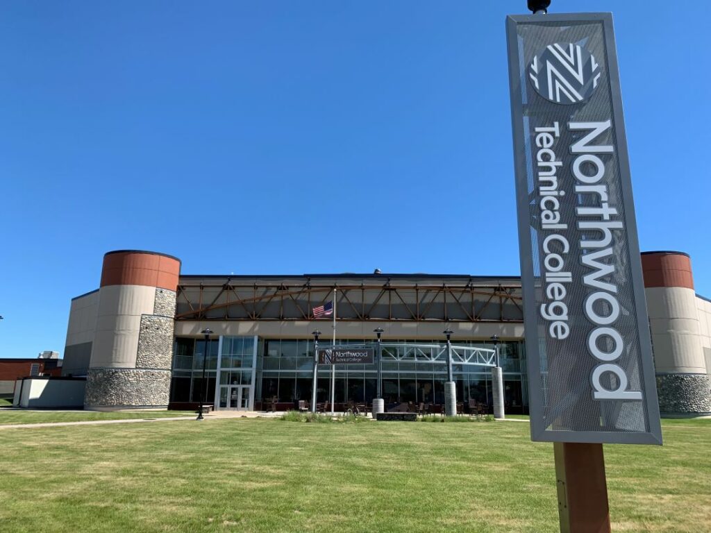 Exterior sign for Northwood Technical College in front of the building.