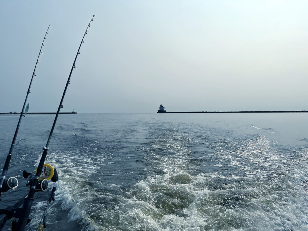 A photo off the back of a fast moving fishing boat showing the waves that form. (Wake)