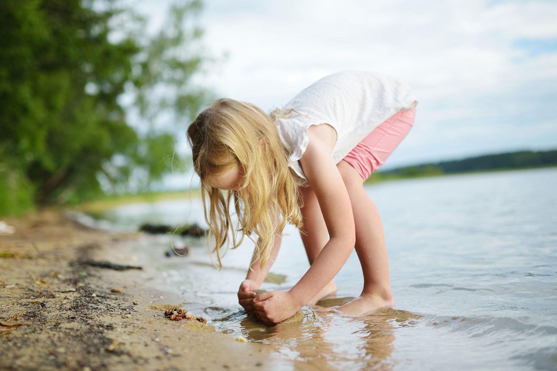 A girl playing in the water enjoys one of the classic summer activities in Superior, Wisconsin.