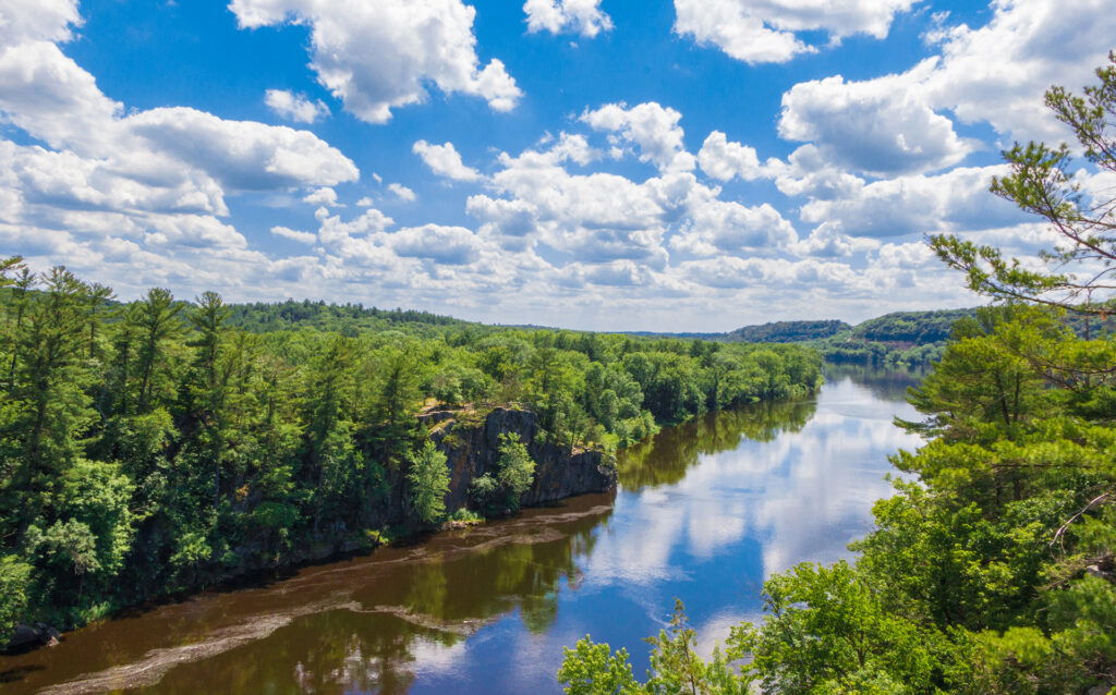 Aerial shot of the St. Croix river with blue sky reflecting.