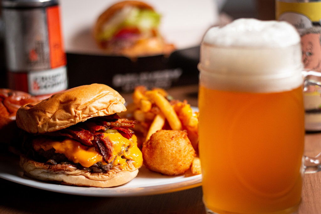 A plate of food and a glass of beer, perfect for enjoying after a day filled with summer activities in Superior Wisconsin.