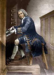 A man in 18th-century clothing plays a pipe organ, seated on a wooden bench. He has white hair, wears a dark coat with gold trim and buttons, white stockings, and black shoes. The scene appears historical and classical.