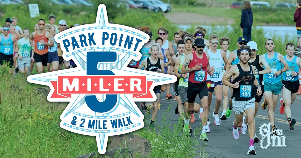 Runners participate in the Park Point 5 Miler & 2 Mile Walk, with a large event logo in the foreground and a group of people in athletic gear running on a paved path outdoors.