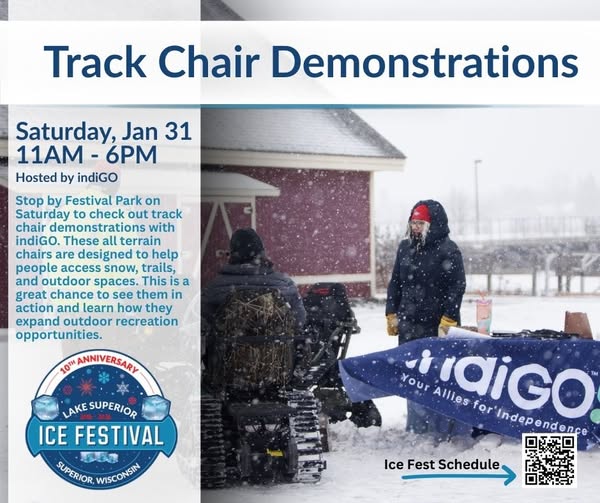 Two people in winter gear use track chairs on snowy ground near an info booth at a festival. A blue banner reads "Track Chair Demonstrations" with event details, logos, and a QR code for the Ice Fest schedule.