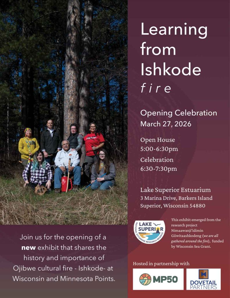 A group of people pose near a fire in the woods. Text invites viewers to the "Learning from Ishkode: fire" exhibit opening, with event details for March 27, 2026, at the Lake Superior Estuarium in Superior, Wisconsin.