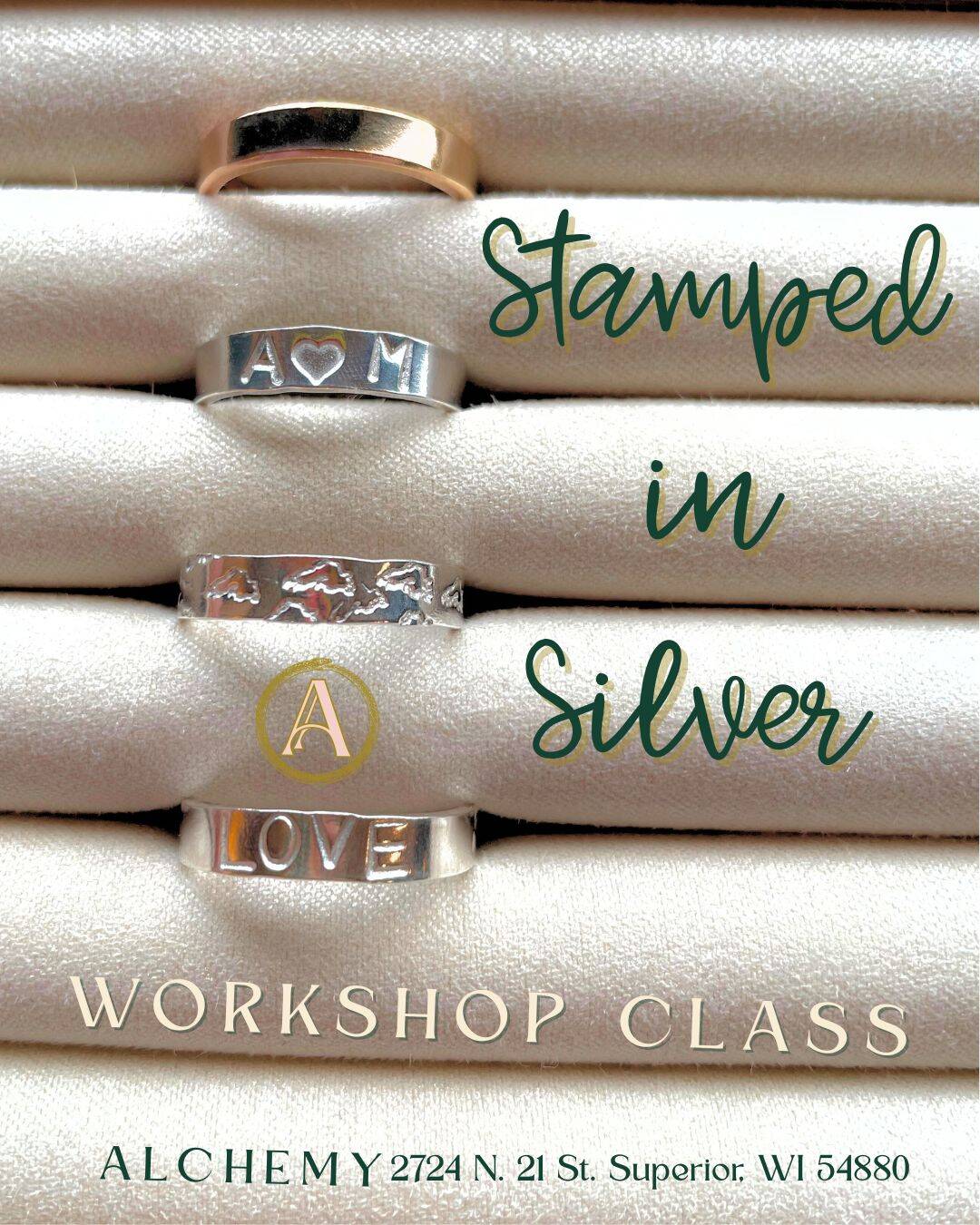 Four silver rings with stamped designs and words are displayed on cream fabric. Text reads: "Stamped in Silver Workshop Class." Address at the bottom: "ALCHEMY 2724 N. 21 St. Superior, WI 54880.