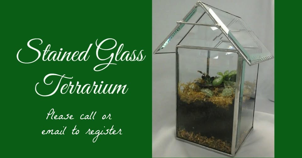 A stained glass terrarium shaped like a house, with soil, moss, and small plants inside. Text on a green background reads: "Stained Glass Terrarium. Please call or email to register.