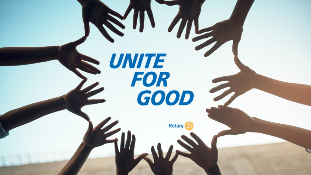 A group of hands forms a circle against the sky, framing the text "UNITE FOR GOOD" in bold blue letters, with the Rotary International logo below.