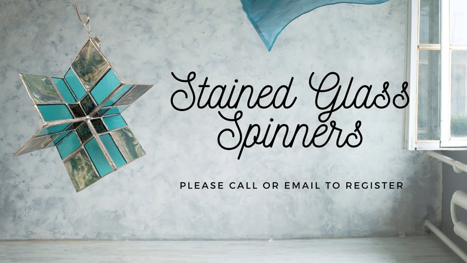 A stained glass star spinner hangs in front of a textured gray wall with the text "Stained Glass Spinners" and "Please call or email to register." A window lets in light from the right side.