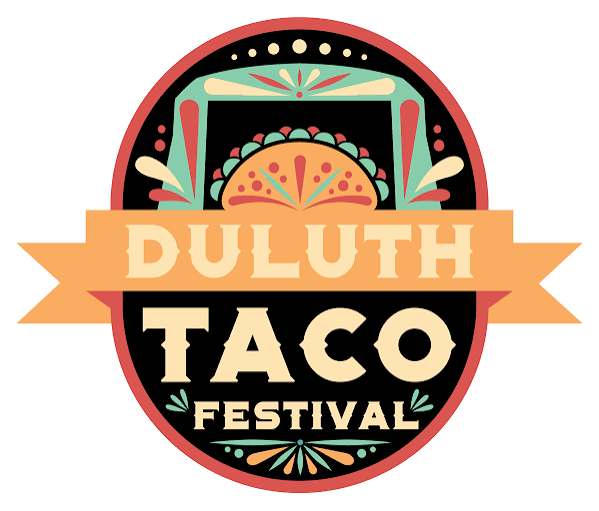A colorful circular logo for the Duluth Taco Festival features a taco illustration at the top, decorative patterns, and bold text reading "Duluth Taco Festival" on a black background with an orange border.