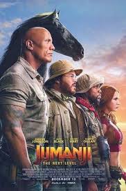 Four adventurers in safari outfits stand side by side with a black horse behind them against a sunset sky. The poster reads "Jumanji: The Next Level" at the bottom, with actors' names above the title.