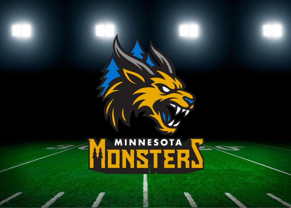 Logo of the Minnesota Monsters, featuring a snarling, stylized monster head with blue and gold accents, set against the background of a lit football field at night.