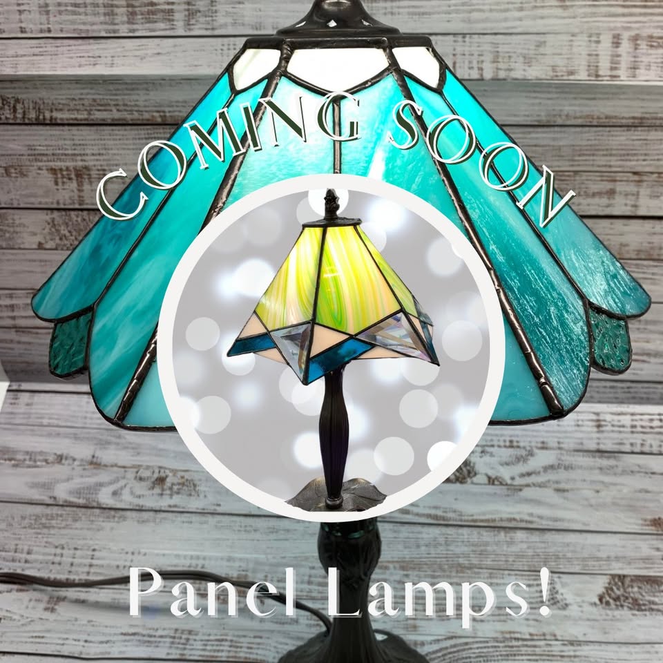 Stained glass lamp with blue and green panels is shown. Overlaid text says “COMING SOON” and “Panel Lamps!” A smaller circle displays a different panel lamp with green and blue glass.