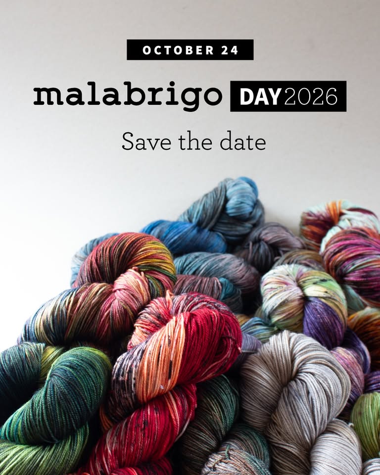 Save the date for Malabrigo Day on October 24, 2026, featuring a pile of multicolored yarn skeins.